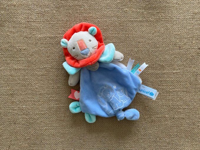 Doudou plat lion bleu DC2886 Unicef Doudou et Compagnie - Article neuf